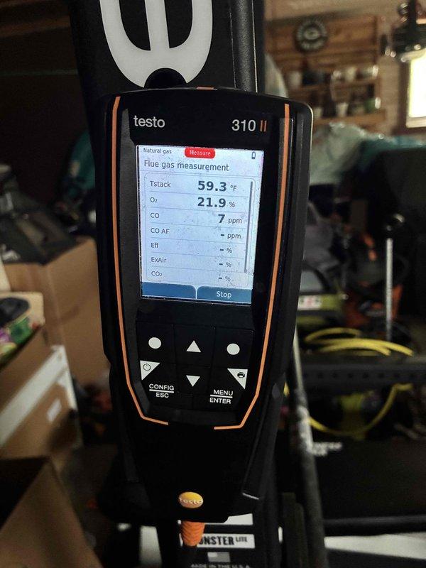 Responded to a reported gas leak at the furnace and performed a diagnostic evaluation with the gas supply shut off. Used a Testo 310 II flue gas analyzer to sample the surrounding area, recording CO levels of 7 ppm and 0 ppm with ambient O2 readings of 21.9% and 20.9%, indicating no hazardous combustion byproducts present. Noted soot-like discoloration on the closet interior, and the gas supply remains off pending further inspection and repair of the leak source.
