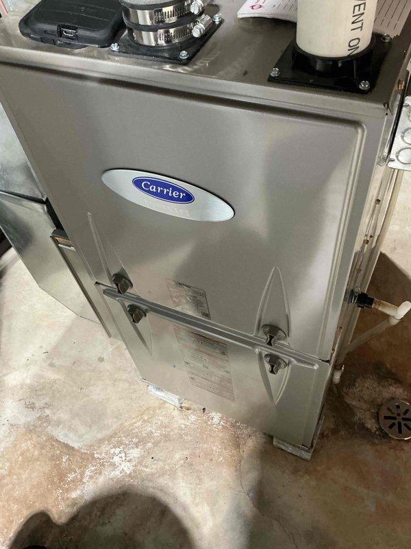 Responded to a no-heat call on a Carrier upright condensing furnace and performed an after-hours diagnostic. Inspected the blower compartment, control board, wiring harness, and motor module, with no visible damage or corrosion found, and checked the condensate drain and venting connections. Verified system operation to isolate the cause of the heating failure and restore service.