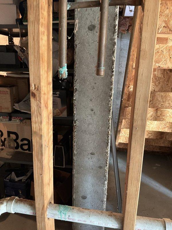 Performed a whole-home plumbing inspection, evaluating the gas-fired Rheem water heater, including its drain pan, gas supply line with shutoff valve, and flue venting connection to the ductwork, along with the visible supply and drain piping in the basement. Noted green corrosion at the open end of a copper supply line and residue near a PVC drain joint, both of which warrant follow-up repair or further evaluation.