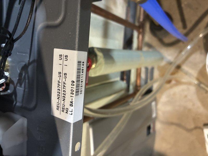 Serviced a natural gas Rinnai tankless water heater (model REU-N3237FF-US) for slow hot water delivery. Connected isolation service valves with hoses and performed a full descaling flush of the heat exchanger to remove mineral buildup restricting flow and heat-up time. Restored the unit to normal operation and verified proper performance.