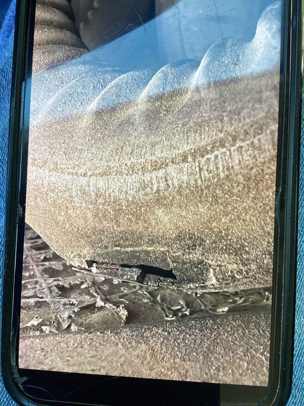 Responded to a no-heat call and inspected the system's flexible ductwork using a borescope, identifying a torn section of the duct's outer jacket and insulation along with dust and debris buildup at a bend in the line. Documented the damaged duct and diagnosed the compromised air distribution as a contributing factor to the loss of heat.