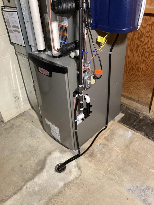 Installed a new Lennox high-efficiency gas furnace with PVC intake/exhaust venting, condensate drain routed to the floor drain, and a whole-house humidifier mounted on the supply plenum, along with an AC system and a 40-gallon power vent water heater. All work was permitted, with electrical connections completed by a licensed electrician, and the system was connected to the existing ductwork and controls.