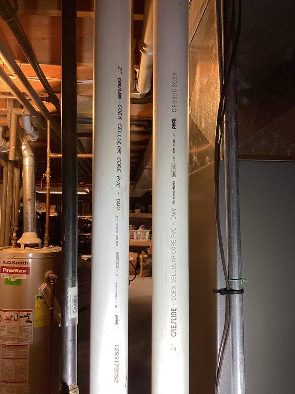 Performed a scheduled HVAC tune-up, inspecting the furnace, plenum, and supply ductwork, along with the flue connection to the water heater and surrounding condensate drain piping, with no evidence of rust, frost, or visible damage. Noted a small hole in the galvanized plenum that should be sealed, and updated the service log sticker on the duct with the completed tune-up entry.
