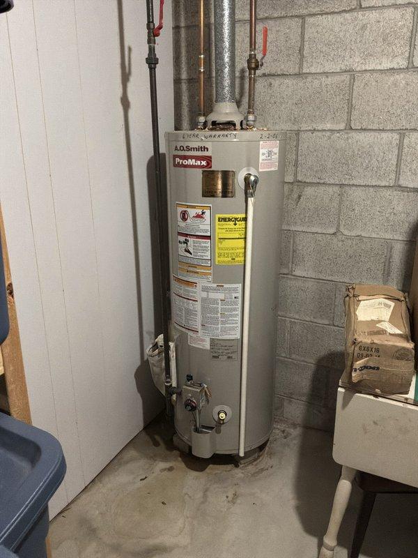 Performed an on-site estimate for replacement of an existing gas-fired A.O. Smith ProMax tank-style water heater, inspecting the unit, gas control valve, flue vent, and supply piping with isolation valves. The tank, installed in 2006 and beyond its warranty period, showed no visible leaks, heavy corrosion, or damage, but its age warranted a replacement recommendation. Also reviewed the kitchen sink area and documented existing conditions with photographs.
