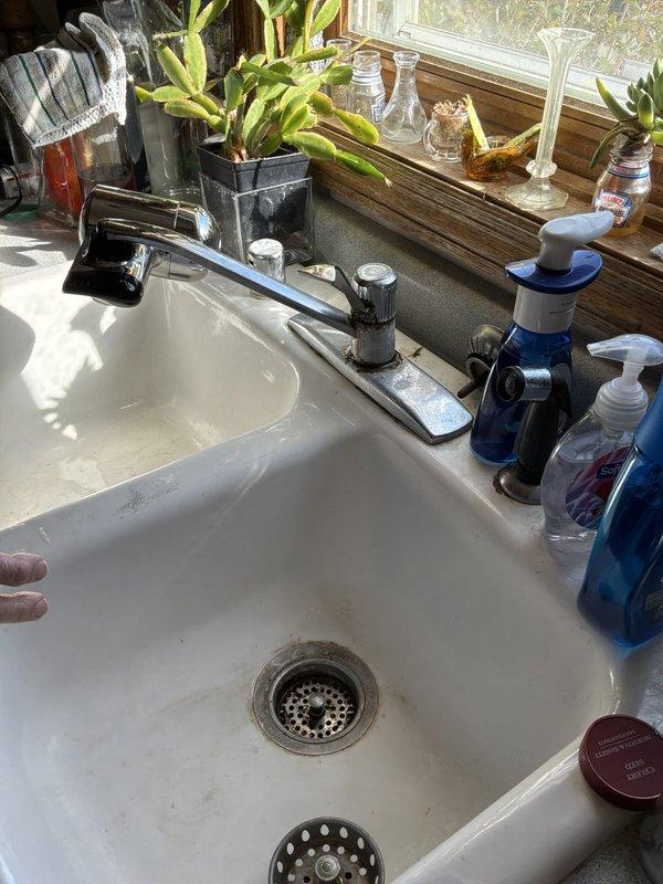Performed an on-site estimate for replacement of an existing gas-fired A.O. Smith ProMax tank-style water heater, inspecting the unit, gas control valve, flue vent, and supply piping with isolation valves. The tank, installed in 2006 and beyond its warranty period, showed no visible leaks, heavy corrosion, or damage, but its age warranted a replacement recommendation. Also reviewed the kitchen sink area and documented existing conditions with photographs.