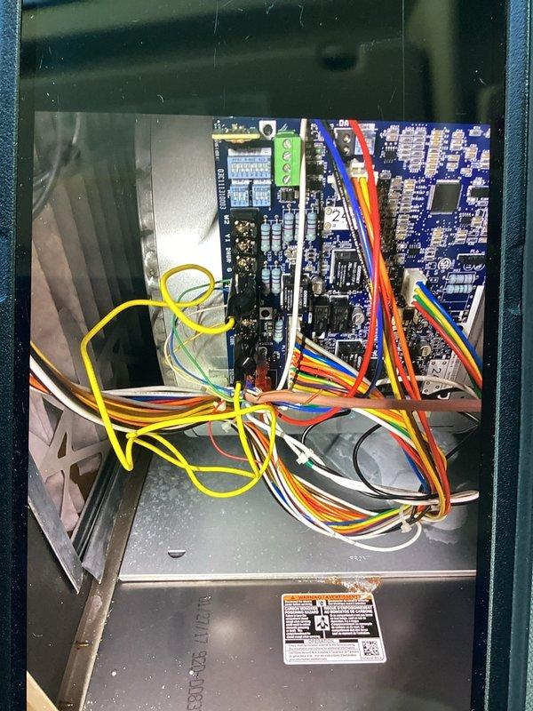 Responded to a no-heat call with a non-powering thermostat and inspected the furnace control board, low-voltage wiring, and terminal connections at the unit. Verified control voltage between R and C, checked for loose or improperly routed thermostat wiring, and tested with a clamp meter to isolate the cause of the power loss to the eco+ thermostat. Corrected the low-voltage wiring issue, restored power to the thermostat, and confirmed proper call for heat and normal furnace operation.