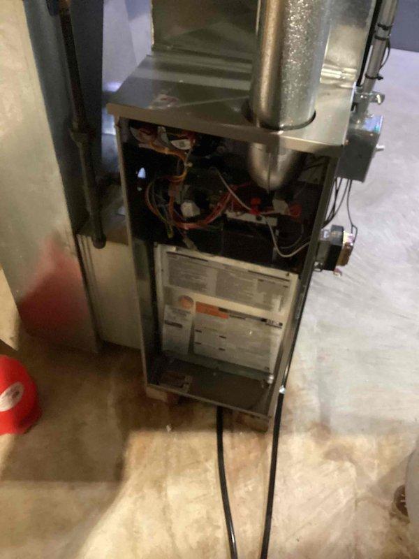 Responded to a no-heat call on a gas furnace under 10 years old and diagnosed the failure as either the control board or the motor, with the necessary replacement parts sourced from local stock. Inspected the unit with the front panel removed, verifying the burner compartment, control wiring, flue venting, and electrical connections to support the repair and restore heating operation.