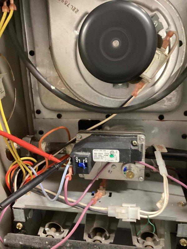 Responded to a no-heat call on a 10+ year old gas furnace; verified thermostat operation and call for heat, then performed electrical diagnostics with a multimeter on the control circuit, inducer motor, pressure switch, and gas valve circuit to isolate the cause of failure. Inspected the blower assembly, wiring connections, and burner assembly, which appeared dusty and worn but intact with no visible cracks, rust, or damage. Completed diagnostic testing to determine the fault and restore heating operation.