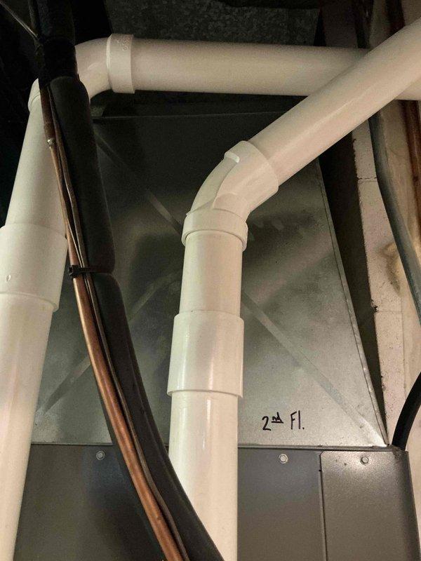 Performed scheduled preventive maintenance tune-ups on two furnaces under the recurring membership agreement, including inspection of the equipment cabinets, electrical connections, condensate PVC drain piping, refrigerant line insulation, and supply plenum ductwork serving the second floor. All components inspected showed no visible rust, cracks, frost, or damage, and service stickers were updated on the units to document the completed maintenance.