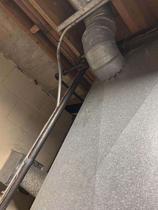 Performed an on-site assessment for installing a new gas line to a range, evaluating the existing overhead pathway above the drop ceiling and in the basement utility area. Inspected the exposed joist space and surrounding piping, conduit, and ductwork to identify a viable routing path and potential obstructions. Documented existing conditions with photos to support material takeoff and installation planning.