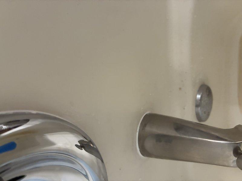 Installed a new tub spout, a customer-supplied post-temperature valve trim kit, and a new handheld showerhead with a flexible stainless steel hose. Sealed the spout base with caulk and verified all fixtures were secure, with no leaks and proper operation of the diverter and temperature control.