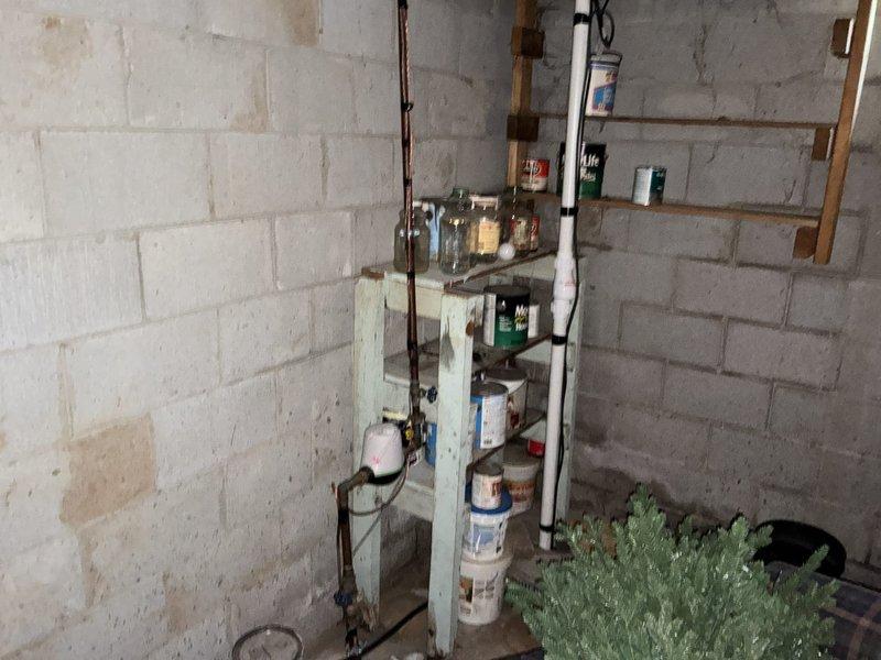 Completed a whole-home plumbing inspection, visually assessing accessible supply and drain piping, including copper supply lines, PVC and ABS drain piping with rubber couplings, and fittings through an open ceiling cavity. Noted staining on concrete block walls and dust accumulation on piping, with no active leaks observed in the documented areas, and photographed all inspected components for the service record.