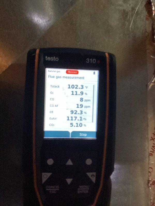 Performed a furnace tune-up, inspecting the ignition system and removing the igniter/flame sensor probe for evaluation. Conducted a combustion analysis with a Testo 310 flue gas analyzer on natural gas, recording a stack temperature of 102.3°F, O₂ at 11.9%, CO at 8 ppm (19 ppm air-free), CO₂ at 5.10%, excess air at 117.1%, and combustion efficiency of 92.3%. Readings indicate safe CO levels and efficient operation.