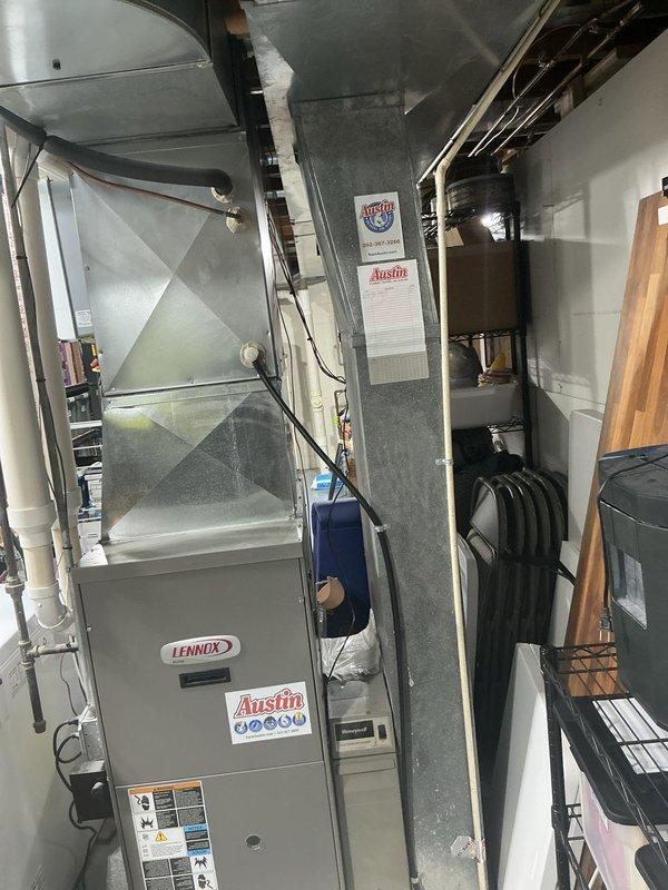 Performed an on-site estimate for replacement of a 17-year-old Lennox natural gas furnace located in the basement mechanical area, following a recommendation from a prior maintenance visit. Inspected the existing furnace, galvanized plenum and ductwork, whole-house humidifier, and associated PVC piping, documenting equipment condition and layout with photos to support replacement options. The unit and surrounding components showed no visible rust, frost, or major damage, and the work area was assessed for access and installation requirements.