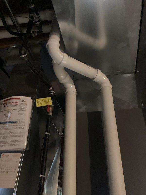Performed a tune-up on the HVAC system, including a static pressure check with a digital manometer, which measured 1.69 inWC. Inspected the condensate drain piping, refrigerant line set, and plenum connections, and found no visible leaks, rust, ice, or damage. Verified system documentation and warranty paperwork were on file at the equipment.