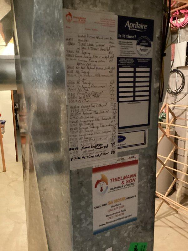 Performed a furnace tune-up, including inspection of the heating system and replacement of the furnace filter. Serviced the Aprilaire whole-home humidifier by replacing the water panel (humidifier pad) and verifying the bypass damper was set to the summer position. Updated the service log label on the supply plenum to record the visit.
