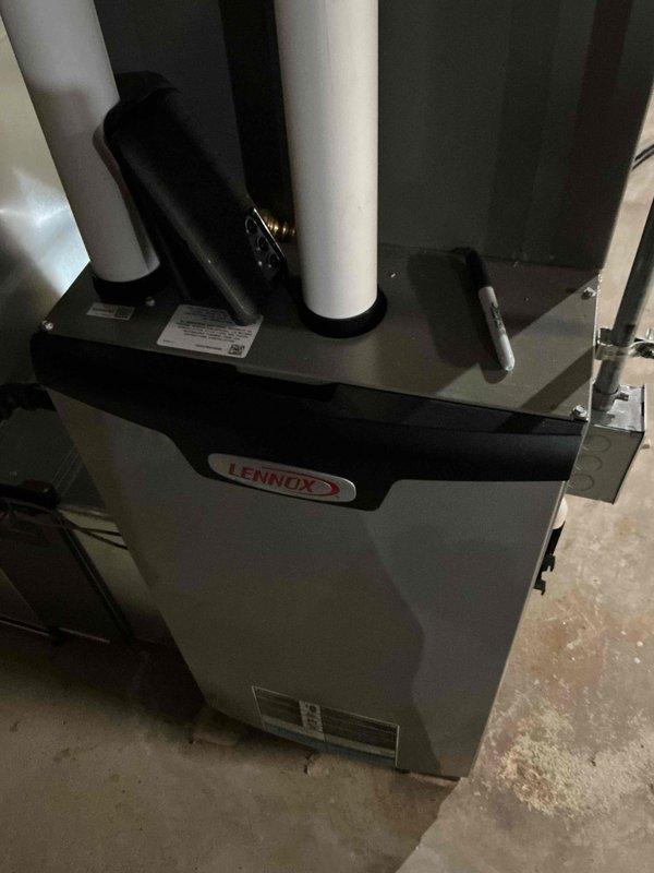 Performed a seasonal tune-up on a Lennox gas furnace, including inspection of the unit, PVC intake/exhaust venting, flexible vent connection, electrical conduit and junction box, and surrounding ductwork. Verified the 16x25 filter size noted on the return and found no visible rust, cracks, or frost damage, with all connections in place and the system ready for winter operation. Noted minor discoloration near an upper PVC elbow for monitoring.