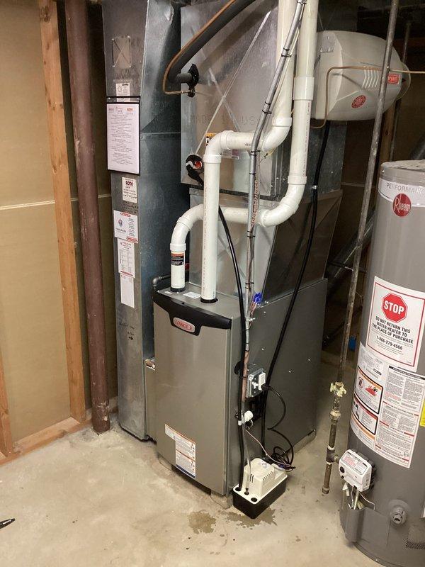 Installed a new Lennox gas furnace with a new thermostat and condensate pump, reusing the existing filter cabinet and adapting the new unit to the existing PVC venting and condensate drain piping. Connected electrical and gas supply, secured and sealed ductwork connections, and completed the installation under permit with electrical work performed. System was started, tested for proper operation, and verified.