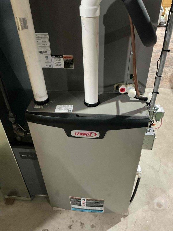 Performed a tune-up on a Lennox upflow gas furnace. Removed and serviced the flame sensor, inspected the burner assembly and sight glass, and verified secure wiring connections. Visual inspection of the unit, PVC vent piping, condensate drain, and electrical components showed no signs of rust, frost, or physical damage, and the furnace was reassembled and returned to service.