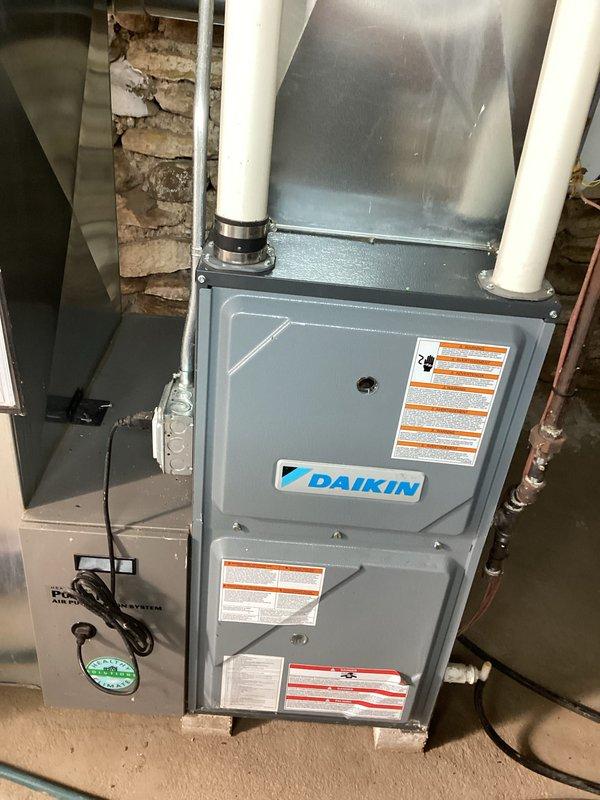 Performed a complete tune-up on the Daikin gas furnace, including inspection of the unit, venting, and electrical connections, and replaced the filter in the supply closet. Cleaned and inspected the Aprilaire humidifier, removing the water panel and distributor housing for service, and verified the associated air purification system. The system was checked for proper operation, with no signs of frost, rust, or damage observed.