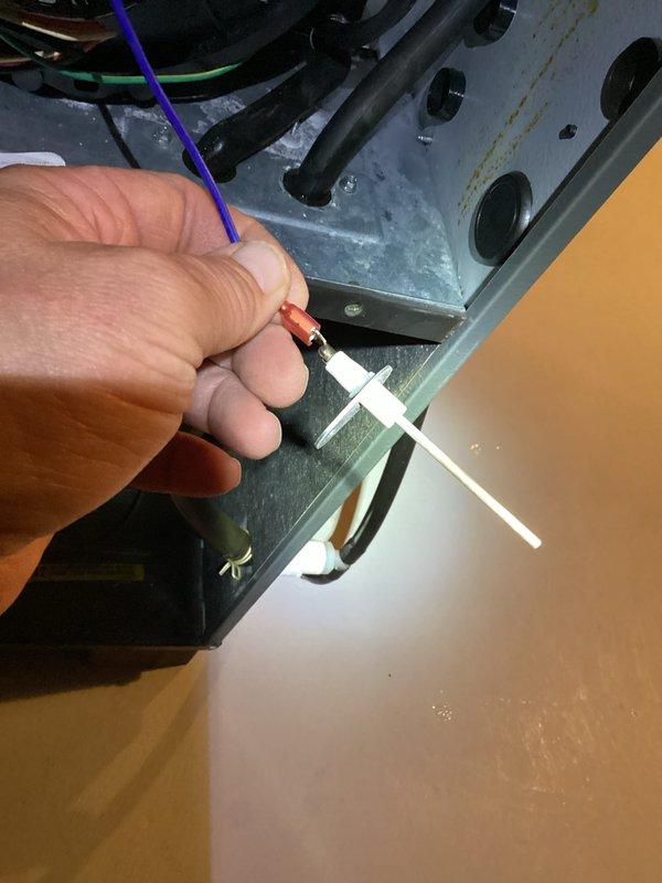 Performed a furnace tune-up with access panels removed, inspecting the gas valve, inducer/blower assembly, control board, wiring harnesses, and gas piping connections. Inspected and serviced the flame sensor/igniter assembly, verified secure electrical connections, and checked the PVC vent and ductwork, noting no visible rust, frost, or damage.