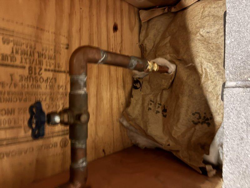 Installed a new exterior hose bibb and ran copper supply piping from the existing line through the crawlspace cavity to the exterior wall, using soldered joints, a branch tee with an isolation valve, and a securely clamped horizontal run. Insulated the supply piping within the wall cavity to protect against freezing and confirmed the new hose bibb is properly mounted and operating with no leaks.