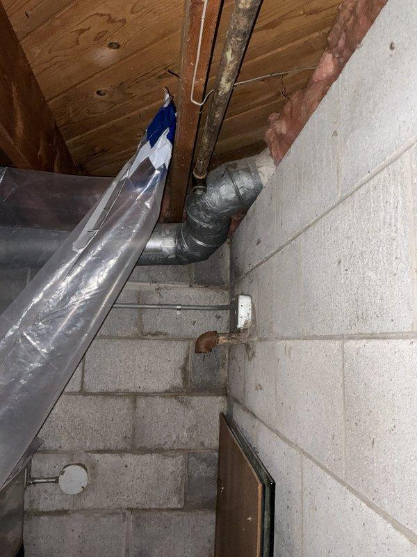 Evaluated the installation of a new gas line to serve a pool heater and outdoor grill. Inspected the existing basement piping, including corroded steel pipe and a wall stub-out, as potential tie-in points. Mapped an approximately 15-foot exterior route across gravel and dirt grade to the equipment pad, and documented the pathway and existing fittings for material takeoff and proposal preparation.