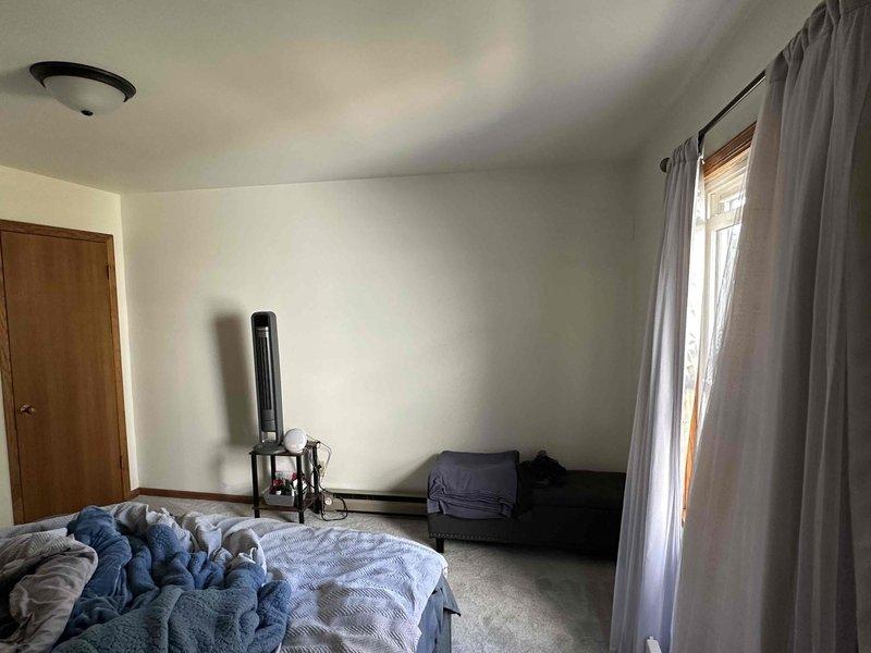 Performed an on-site evaluation of a Mitsubishi mini split system reported as non-repairable and assessed the interior bedroom and exterior patio areas to determine suitable replacement and alternative heating and cooling options. Reviewed potential indoor head and outdoor condenser placement, noting the existing baseboard heat and sufficient wall space and clearance for installation, with no visible damage or obstructions at either location. Customer was presented with replacement and alternative system options for consideration.