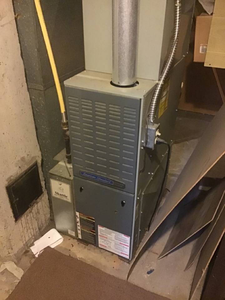 Furnace repair on an American standard furnace.