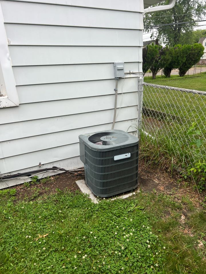 Performed air conditioning repair and evaluation on a 20 year old Goodman system; found no cool on arrival and compressor not starting due to failed capacitor. Replaced dual capacitor, installed start assist device, cycled and verified AC operations. 