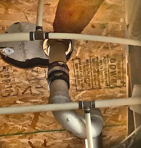 Pride Plumbing was called out to investigate the cause of a water stain on a downstairs ceiling in two different areas. Our inspection found that one leak was being caused by a leaking upstairs shower drain and the second leak was being caused by an HVAC condensation line. We cut out and replaced the leaking shower drain with a new Mainline ML42150 drain and corrected the one leak. We advised the customer to contact an HVAC company to come out and look at the second leak. We also provided a price quote to replace a bathtub/shower faucet valve with a new Delta model. All work was agreed upon before being performed.