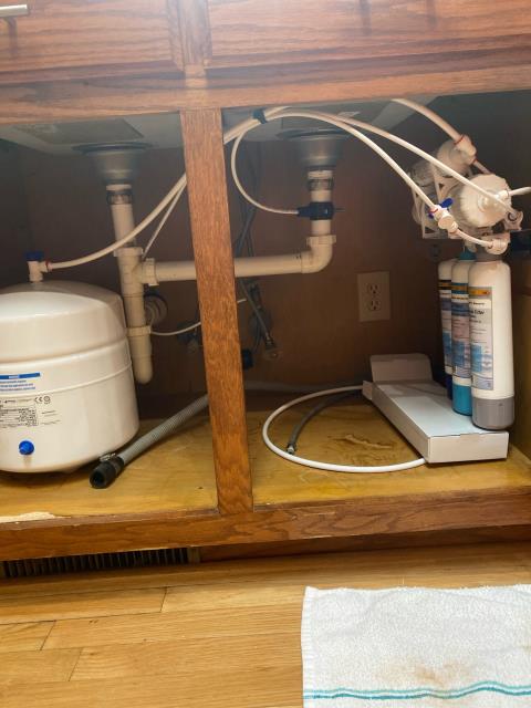 Pride Plumbing came out and performed the following work: 1) replaced a 38-gallon A.O. Smith electric low-boy water heater with a new 38-gallon electric Rheem low-boy model (this included removing and disposing of the old water heater; and installing the new water heater, new ball water shut-off valves, new PEX and stainless steel water supply lines to the water heater's water connections, a new brass drain valve, connecting the unit's electrical connections, ensuring that the unit was properly vented, and setting it to its appropriate operating temperature); and 2) installed a Sterling reverse osmosis water filtration system underneath a kitchen sink.