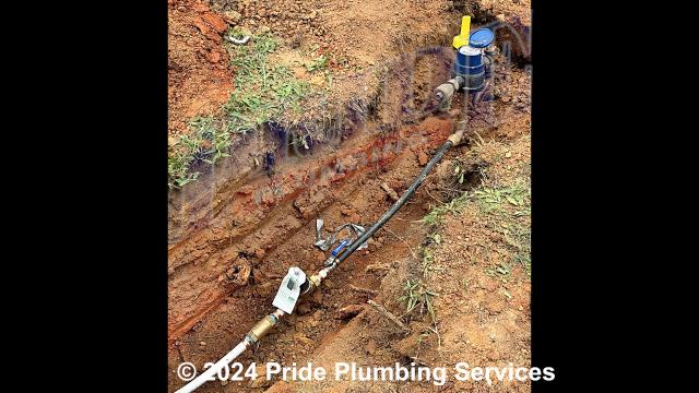 Pride Plumbing came out and: 1) trenched a ditch from an existing water meter to the house to expose and remove the outside main water supply line; 2) installed a new 1-inch black roll and PEX outside main water supply line from the water meter to the house along with installing tracer wire; 3) connected the new water line to an existing water line connection under the house and installed a ball valve main water cut off in the crawlspace; 4) installed a new pressure reducing valve (PRV), ball water shutoff valve, and check valve at the water meter in the meter box; 5) tested the new water line for leaks and working order; and 6) backfilled and tamped the ditch after the work was completed and approved by the county’s inspection department.