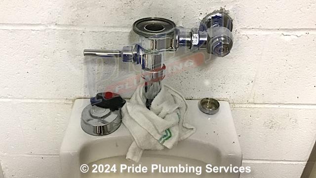 Pride Plumbing came out and rebuilt a leaking Sloan Flushometer flush valve on a Sloan commercial urinal (this included removing and replacing the flush valve’s diaphragm, vacuum breaker, and spud gasket). After reinstalling the flush valve, we turned the water back on and tested for leaks and proper operation with no issues.