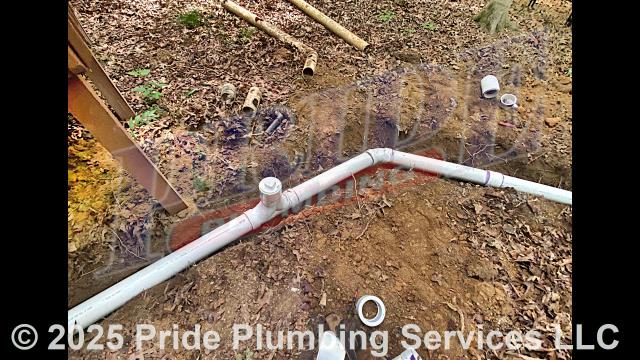 Pride Plumbing came out and performed the following work: 1) hand-dug a ditch from the house to the septic tank to expose and remove the outside main sewer septic drain line; 2) installed a new 4-inch PVC sewer drain line (connecting it to the main drain line under the home) along with proper cleanouts and fittings per code; 3) installed tracer wire in the ditch along with the new sewer drain line; and 4) sealed the septic tank penetration and backfilled, tamped, and spread grass seed and straw after the work had been completed.
