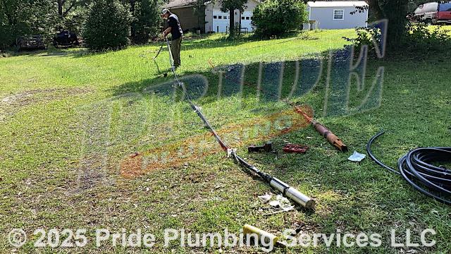 Pride Plumbing was called out for low water pressure from a well. Our inspection determined that the well's submersible pump had gone out. We pulled out the well's black roll piping and submersible pump. Then, after preparing a new pump assembly, we inserted a new Pentair Pentek P42B0005A2-01 submersible pump and black roll piping (with an attached torque arrestor and cable guards) back down into the well. Then we replaced the well's inlet and outlet piping with new PEX piping and fittings, reconnected the piping to the well's pressure tank, and used a heat shrink kit to reseal the well. We then opened an outside hose bib spigot and drained debris out of the water line, letting it run for several minutes.