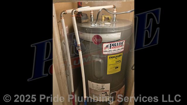 Pride Plumbing came out and replaced a leaking 40-gallon electric water heater with a new 40-gallon electric Rheem PROE40-M2-RH95 model. First, after disconnecting its electrical connections and inlet and outlet water lines, we removed and disposed of the old water heater. Then we installed the new water heater, ball water shut-off valves, PEX and stainless-steel water supply lines to the water heater connectors, a brass drain valve, and wired up the electrical connections to the new water heater. Finally, we bled the air out of the water lines, ensured that the unit’s temperature and pressure (T&P) relief valve was properly vented, and set the unit to its appropriate operating temperature. We also upgraded the unit's elements to 3,500-watt elements due to it being on a double pole 20-amp breaker.