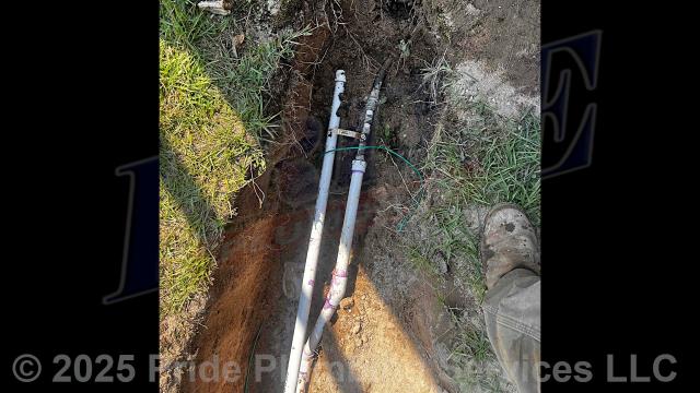 Pride Plumbing came out and: 1) trenched a ditch from an existing water meter to the building to expose and remove the outside main water supply line; 2) installed two new 1-inch pressure PVC outside main water supply lines from the water meter to the building along with installing tracer wire; 3) connected one of the new water lines to an existing water line connection just outside the building's foundation and installed a ball valve main water cut off (we capped the other water line - it's there for future use); 4) installed a new pressure reducing valve (PRV), ball water shutoff valve, and check valve at the water meter in the meter box; 5) tested the new water line for leaks and working order; and 6) backfilled and tamped the ditch after the work was completed and approved by Moore County’s Inspection Department.