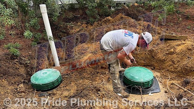 Pride Plumbing came out and, after digging up the home's septic tank, installed two septic tank risers, lids, safety inserts and a sewer popper. We used the tank mastic to set the risers to the tanks. We also dug down in the yard to expose a defective section of the outside main sewer septic drain line that was broken and leaking; replaced that section of sewer line with new 4-inch PVC piping and fittings, connecting onto the existing drain piping with new Fernco and no-hub couplings; installed a new two-way PVC clean out; sealed the septic tank penetration; tested the new piping for leaks and working order; and backfilled, tamped, and spread grass seed and straw after the work was completed.