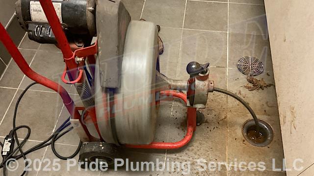 Pride Plumbing was called out for sewage backing up into the building. We ran a sewer machine down through a floor drain, from a manhole back into the building, at a cleanout at the back of the building, and cleared the blockage. We inserted a camera into the drain line, and it revealed a belly in the line. We also provided a cost estimate to trench a ditch from the town sewer tap to the building to expose and replace the main outside sewer septic drain line with new PVC piping and fittings along with installing proper cleanouts and fittings per code.