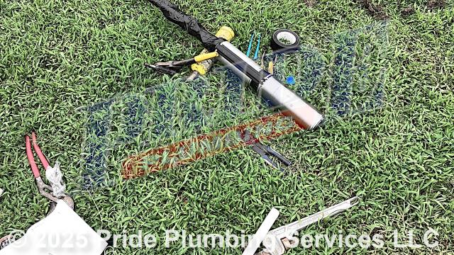 Pride Plumbing came out to repair a well. First, we pulled out the well's black roll piping and submersible pump. Then, after preparing a new pump assembly, we inserted a new Pentair P42B0005A1-01 submersible pump and black roll piping (with an attached torque arrestor and cable guards) back down into the well. Next, we replaced the well's outlet piping (with new PEX piping and fittings), pressure tank (with a new Goulds V60 HydroPro model), tank tee, 30/50 pump switch, pressure gauge, brass nipple, and wiring and used a heat shrink kit to reseal the well. Finally, after turning the well back on, we opened an outside hose bib spigot and drained debris out of the water line, letting it run for several minutes.