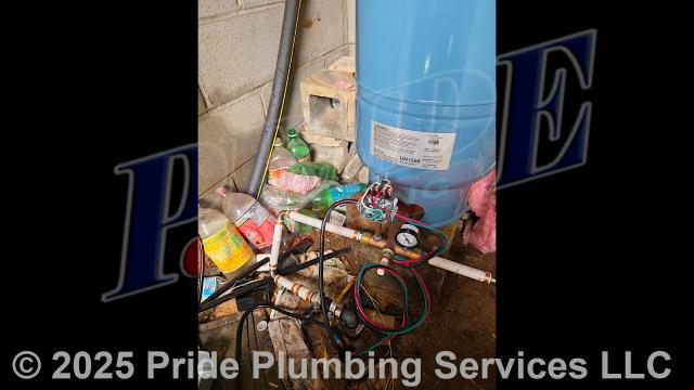 Pride Plumbing came out to repair a well. First, we pulled out the well's black roll piping and submersible pump. Then, after preparing a new pump assembly, we inserted a new Pentair P42B0005A1-01 submersible pump and black roll piping (with an attached torque arrestor and cable guards) back down into the well. Next, we replaced the well's outlet piping (with new PEX piping and fittings), pressure tank (with a new Goulds V60 HydroPro model), tank tee, 30/50 pump switch, pressure gauge, brass nipple, and wiring and used a heat shrink kit to reseal the well. Finally, after turning the well back on, we opened an outside hose bib spigot and drained debris out of the water line, letting it run for several minutes.