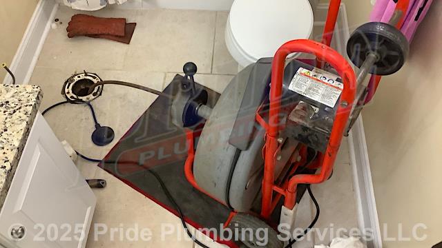 Pride Plumbing was called out for a toilet backing up into the bathtub when flushed. After pulling the toilet, we used a sewer machine down through the toilet's flange and cleared the blockage. After replacing the toilet bowl's wax ring gasket and closet bolts, we reset the toilet, tested it, and the issue was resolved. We found a second toilet that was leaking. We rebuilt its water supply stop, replaced it braided stainless-steel water supply line and water fill valve, and tested the toilet for leaks with no further issues. There was also a bathroom sink that was slow draining. We cleared a hair clog out of its popup assembly and corrected the issue. We provided cost estimates to replace the toilets with new Gerber Viper models and replace the bathroom's cast iron piping with new PVC piping and fittings.