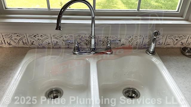 Pride Plumbing came out and performed the following work: 1) installed a new two-compartment stainless steel kitchen sink (along with its basket strainers, P-trap, end outlet waste, dishwasher tailpiece, PVC drain line (tying into the existing drain line under the house), and hot and cold PEX and stainless steel braided water supply lines and their water supply stops); 2) installed a kitchen sink faucet; 3) installed an air admittance valve on the sink's drain line; 4) reconnected a Pentair Everpure 4CB5 water filter; and 5) caulked around the sink.