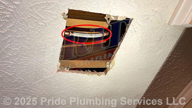 Pride Plumbing was called out for a water leak in a downstairs ceiling. After gaining access into the ceiling, our inspection found a leak on a copper water supply line. We cut out the leaking section of copper pipe and repaired it with new PEX piping and fittings. We also provided a cost estimate to repipe and replace the water supply lines in the attic, going to the fixtures in the kitchen (sink faucet, dishwasher, and ice maker), one bathroom (sink, toilet, and bathtub/shower), the washing machine (installing a new plastic washer box and hot and cold hose bibs or boiler drains), and the water heater, with new PEX piping and fittings (installing new 1/4 turn water shut-off valves on each fixture inside the house along with new above-floor stainless steel braided water supply lines) and replace two outside hose bib spigots with new Woodford frost-free models.