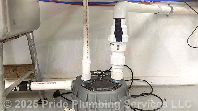 Pride Plumbing came out and performed the following work: 1) raised a three-bay stainless-steel kitchen sink to a height that allowed its drain to gravity-feed into a Liberty 404 residential drain pump; 2) installed the drain pump beside a third stainless-sink and ran its PVC vent pipe up the wall to a seven-foot height; 3) ran a separate PVC drain line (with ball and check valves) through the wall to a bathroom and tied it into the main drain stack; 4) at a utility sink, added a Santee and air admittance valve and ran its drain into the main drain stack; 5) installed a new P-trap, Santee, and air admittance valve on a bathroom sink and connected them to a drain located in the floor; and 6) tested all installations/repairs for leaks and proper working order.