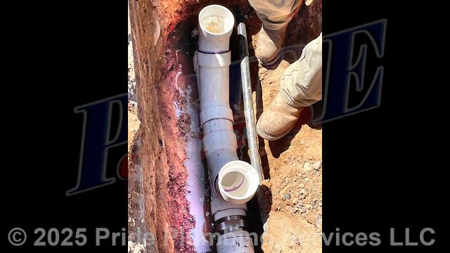 Pride Plumbing came out and dug down underneath a short section of asphalt pavement, uncovered and cut into the outside main sewer septic drain line, installed two new one-way PVC cleanouts with brass caps (connecting them to the existing outside main sewer septic drain line going to the town sewer tap, and the septic line going underneath the building's foundation, with new PVC fittings and no-hub couplings, tested the new piping for leaks and working order, backfilled the area we dug out, and installed gravel over the area.