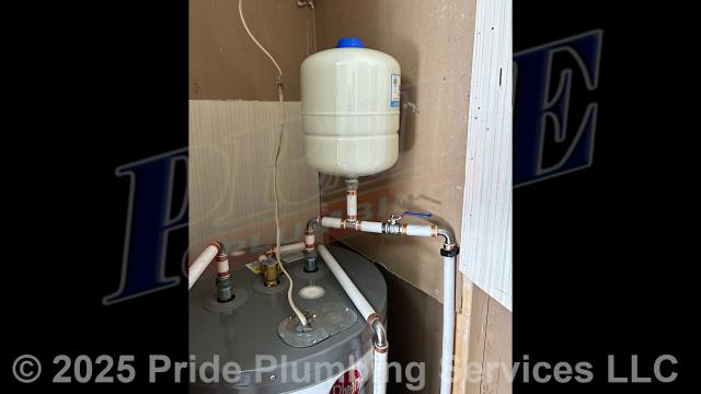 Pride Plumbing came out and installed a new HydraPro HPTET2 2-gallon thermal expansion tank at a Rheem electric water heater, tying the expansion tank into the existing PEX water supply line with new copper piping and fittings.