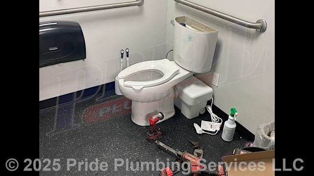 Pride Plumbing came out and installed a Liberty Ascent II macerating toilet. This also required us to cut the sheetrock on the backside of the bathroom wall and install a new check valve on the pump's discharge drain line. After the installing two plastic plumbing access panels over the holes we cut in the wall, we tested for leaks and proper operation of the pump system.