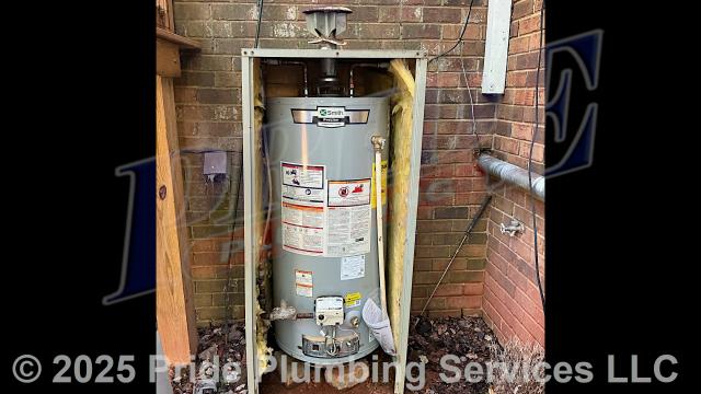 Pride Plumbing came out and replaced a leaking 40-gallon natural gas Whirlpool N40S61-403 water heater (located inside an AquaHut) with a new 40-gallon natural gas A.O. Smith model with an atmospheric vent. This included removing and disposing of the old water heater along with its electrical wiring, venting, and gas and water supply lines; and installing the new water heater, new ball water shut-off valves, new PEX and stainless steel water supply lines and copper gas supply lines to the water heater connectors, a temperature and pressure (T&P) relief valve, a brass drain valve, atmospheric vent and ensuring the unit was properly vented, and lighting the pilot and adjusting its flame.